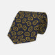 The Navy and Gold Petal Paisley Silk Tie by Turnbull & Asser features a repeating yellow abstract pattern, neatly rolled on a white background.