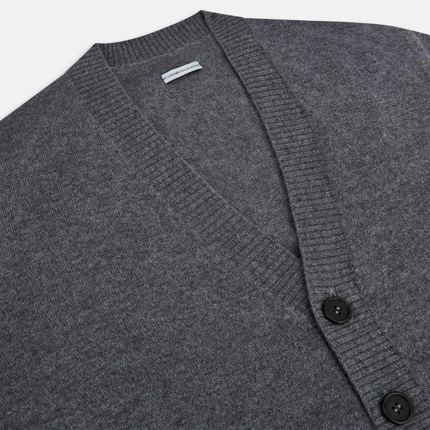 View 2 of product The Turnbull & Asser Grey Melange Cashmere Cardigan features a V-neck, ribbed cuffs and hem, front buttons, and two pockets—an elegant piece from our timeless knitwear collection. Shown here against a plain white background.