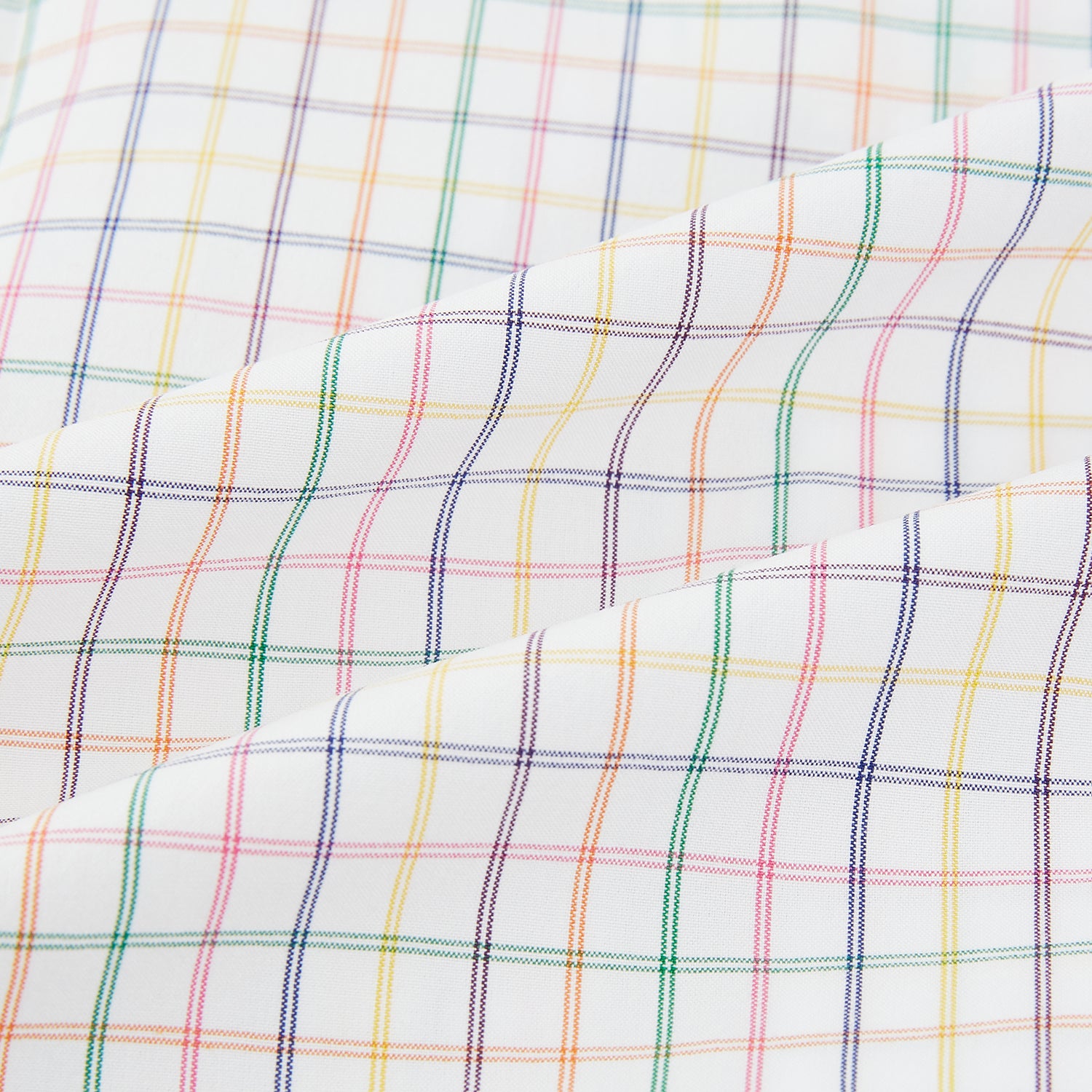 View 6 of product The Rainbow Double Grid Check Mayfair Shirt by Turnbull & Asser features a white base with thin blue, red, and green checks and a T&A collar. It’s displayed neatly laid flat on a white background.