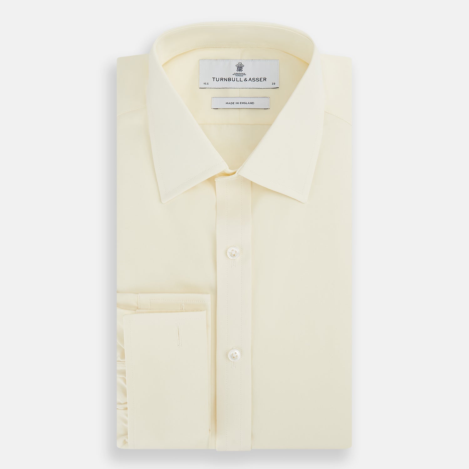 View 5 of product The Turnbull & Asser Cream Cotton Shirt features a T&A collar and double cuffs, elevating men's style. Displayed flat against a white background, this long-sleeve shirt is crafted in classic cream cotton.