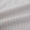 View 6 of product The Turnbull & Asser Grey Micro Shadow Check Mayfair Shirt is crafted from premium Italian cotton with long sleeves, a collar, and buttoned cuffs, shown folded flat against a white background.