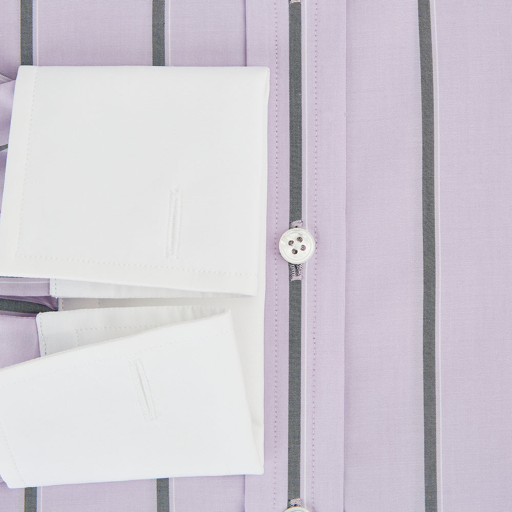 The Turnbull & Asser Lilac Track Stripe Shirt with Contrast T&A Collar and Cuffs features vertical black stripes, a white pointed collar, and white cuffs, shown flat against a white background.