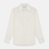 View 1 of product The Cream Silk Long Point Embroidered Eamon Shirt by Turnbull & Asser features long sleeves, a pointed collar, and delicate botanical embroidery. Its buttoned cuffs and tailored fit make it an elegant partywear choice.
