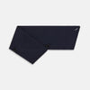 View 3 of product The Turnbull & Asser Navy Silk and Cotton Neck Warmer features a dark navy blue textured fabric and a single black button, shown against a plain light gray background.