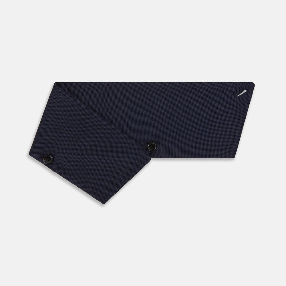 The Turnbull & Asser Navy Silk and Cotton Neck Warmer features a dark navy blue textured fabric and a single black button, shown against a plain light gray background.