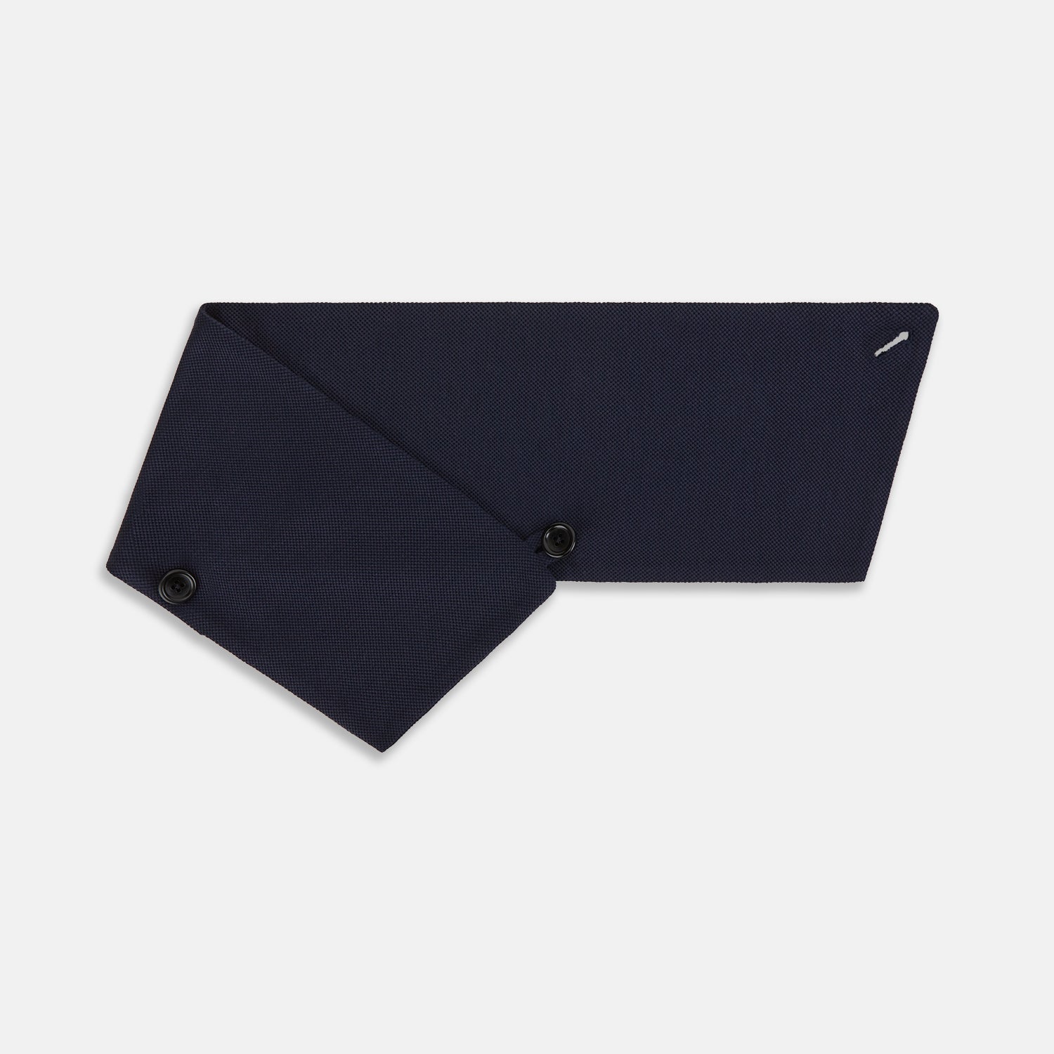 View 3 of product The Turnbull & Asser Navy Silk and Cotton Neck Warmer features a dark navy blue textured fabric and a single black button, shown against a plain light gray background.