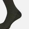 View 4 of product A single forest green mid-length sock from Turnbull & Asser, featuring a motif pattern and crafted from soft mercerised Egyptian cotton, shown against a plain white background.