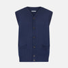View 1 of product The Turnbull & Asser Navy Fine Merino V-Neck Sleeveless Cardigan features a front button closure, ribbed hem, and two pockets—sophisticated knitwear shown on a plain white background.