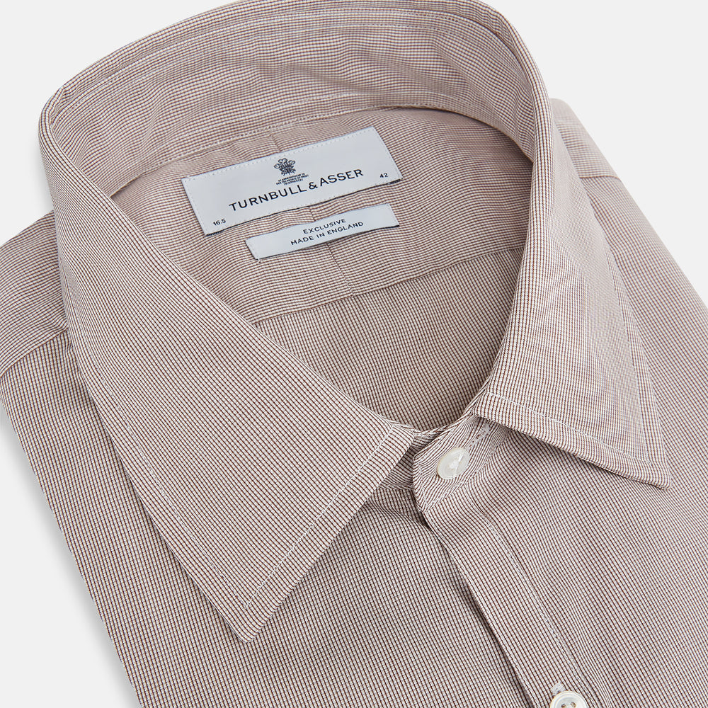 The Turnbull & Asser Brown Micro Graph Check Westminster shirt features long sleeves, a pointed collar, and buttoned cuffs—showcasing British craftsmanship and displayed flat on a white background.