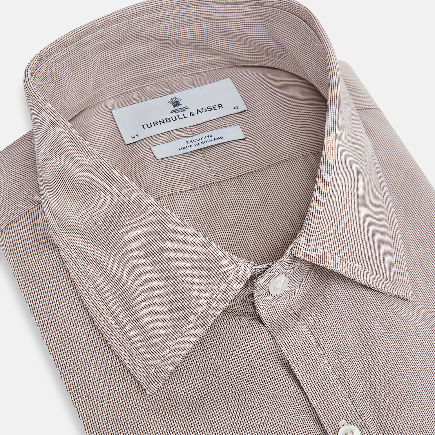 View 2 of product The Turnbull & Asser Brown Micro Graph Check Westminster shirt features long sleeves, a pointed collar, and buttoned cuffs—showcasing British craftsmanship and displayed flat on a white background.