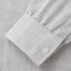 View 4 of product A Grey Fine Check Cotton Blend Weekend Fit Suffolk Shirt by Turnbull & Asser with long sleeves, a collar, and single chest pocket is laid flat on a white background.