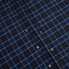 View 7 of product The Turnbull & Asser Navy and White Check Windsor Shirt features a long-sleeve design with a navy base and white check pattern, showcasing British craftsmanship and displayed on a white background.