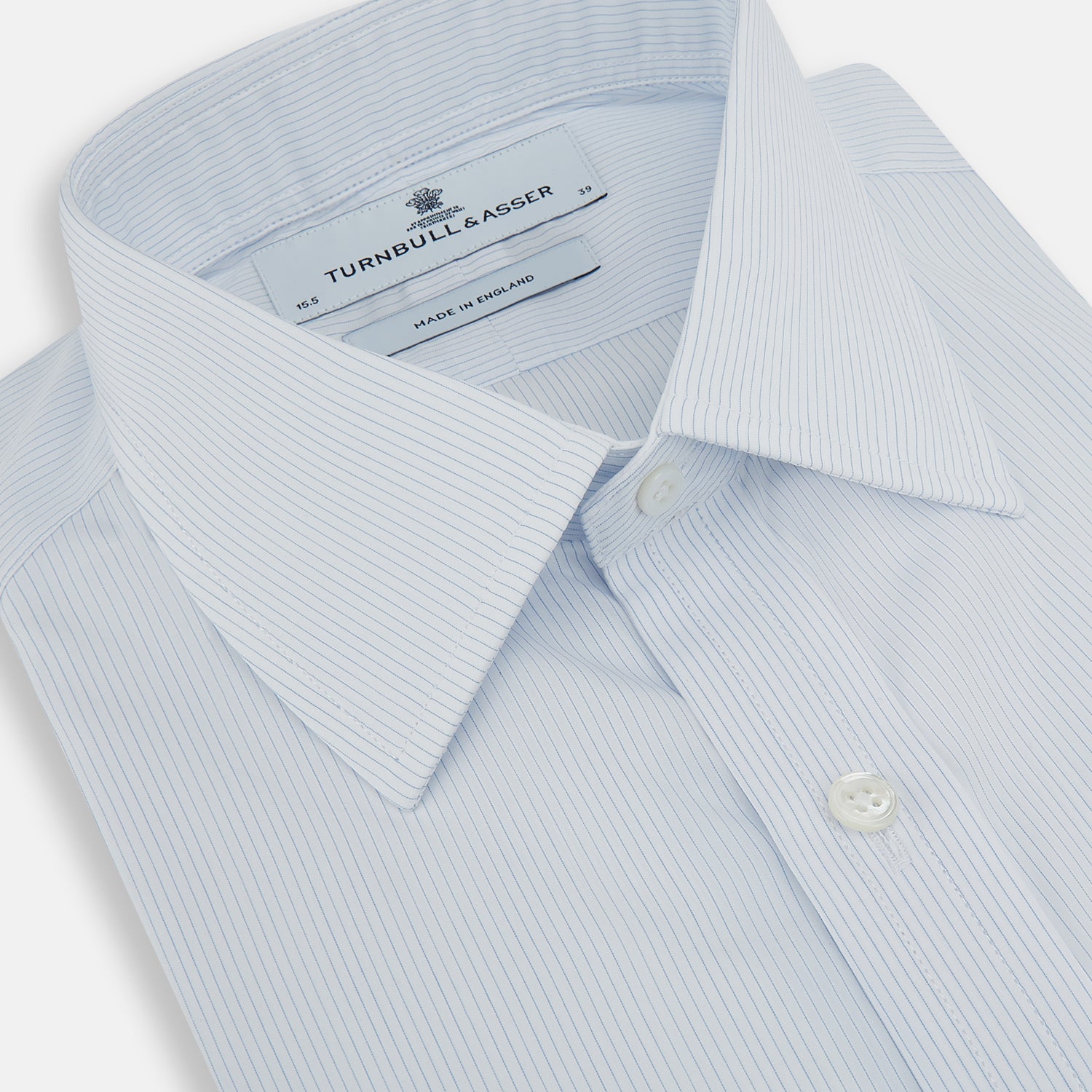 View 2 of product The Turnbull & Asser Blue and White Thin Stripe Shirt features a T&A collar and double cuffs, shown against a plain white background.