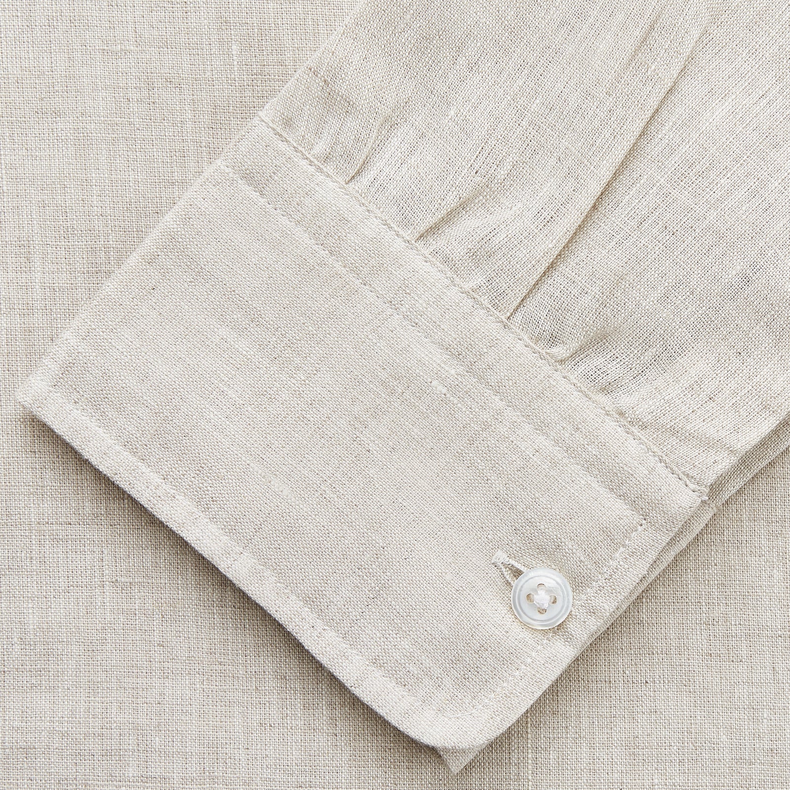 View 3 of product The Turnbull & Asser Light Oatmeal Linen Weekend Fit Unwin Shirt features long sleeves, a band collar, and two chest pockets—an ideal choice for effortless summer style.