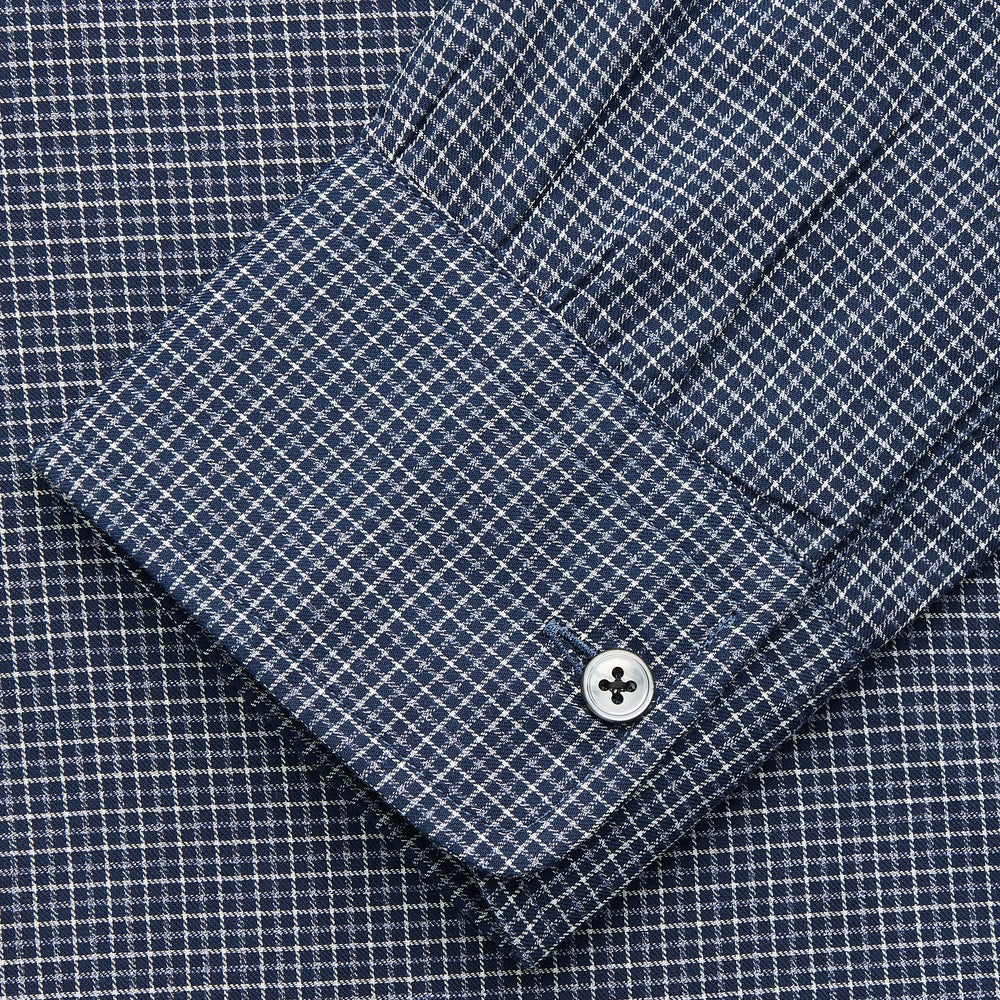 The Turnbull & Asser Navy Check Weekend Fit Flannel Shirt features a stand collar, button front, two chest pockets with flaps, and 1-button cuffs, crafted from soft Italian cotton and shown laid flat on a white background.
