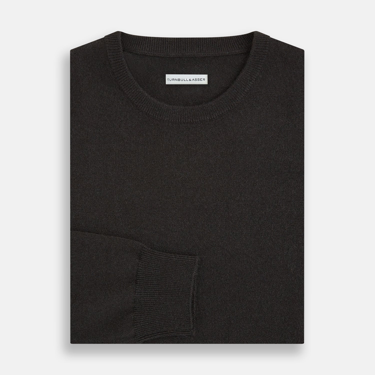 View 4 of product A plain, long-sleeved brown cashmere round neck jumper by Turnbull & Asser displayed on a white background. This men’s knitwear features ribbed cuffs, hem, and neckline with a relaxed fit and no visible patterns or logos.