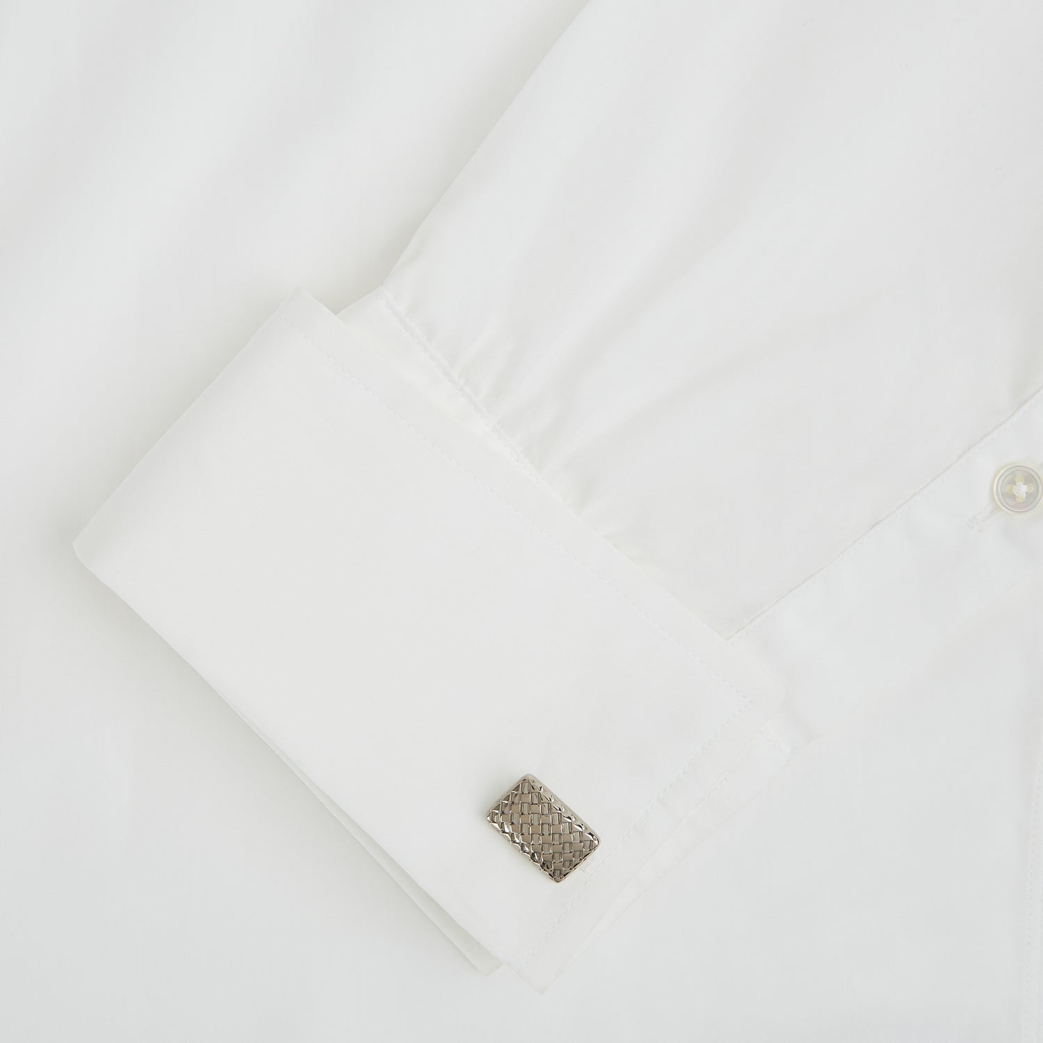 View 3 of product Turnbull & Asser Silver Basketweave Rectangular Cufflinks feature a striking basketweave design on the front and are showcased on a white background.