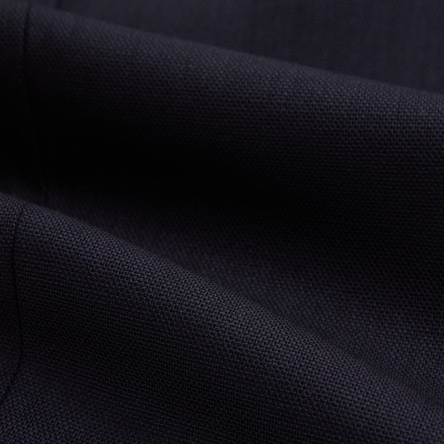 View 7 of product The Navy Rupert Trousers by Turnbull & Asser are tailored wool trousers with a button and zip closure, belt loops, and front creases, elegantly displayed against a plain white background.