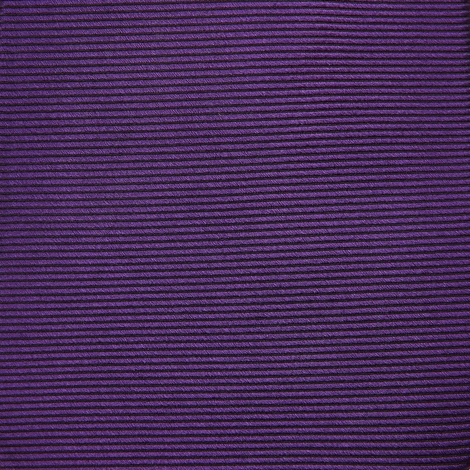 View 3 of product The HORIZONTAL TWILL PLUM TIE by Turnbull & Asser features a solid purple hue and smooth, subtly textured fabric—a versatile accessory to elevate any wardrobe, shown elegantly against a white background.