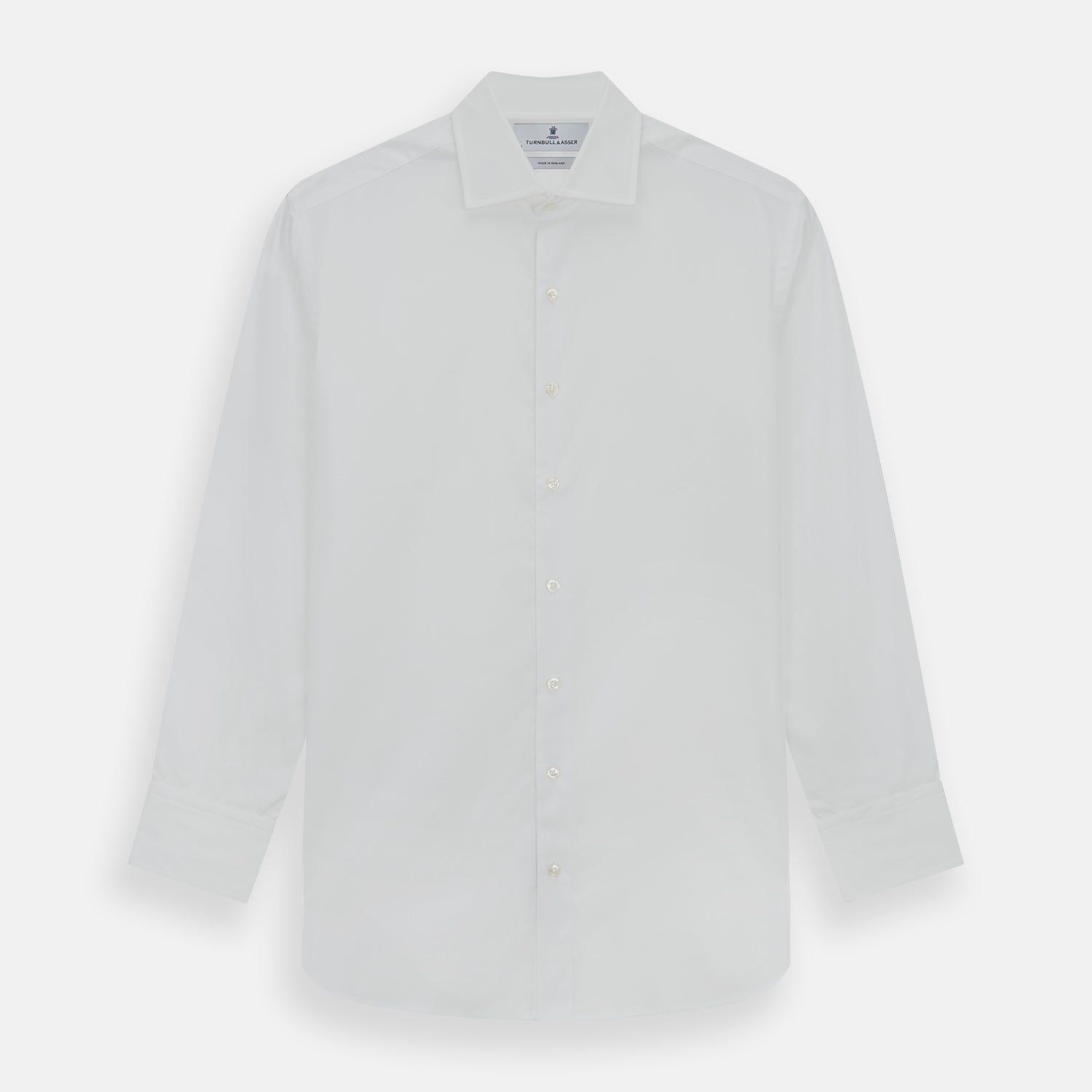 View 1 of product The Turnbull & Asser Tailored Fit Plain White Cotton Shirt features a classic kent collar and 3-button cuffs, displayed against a white background.