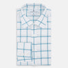 View 5 of product The Turnbull & Asser Turquoise Grid Check Mayfair Shirt is crafted from Italian cotton with a white base and turquoise grid pattern, featuring long sleeves, a pointed collar, and buttoned cuffs.