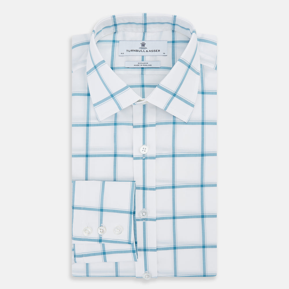 The Turnbull & Asser Turquoise Grid Check Mayfair Shirt is crafted from Italian cotton with a white base and turquoise grid pattern, featuring long sleeves, a pointed collar, and buttoned cuffs.