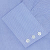 View 3 of product The Turnbull & Asser Blue Royal Oxford Cotton Shirt features a button-down collar, 3-button cuffs, and a visible brand label, shown neatly folded on a white background—ideal for pairing with a navy suit.