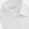 View 2 of product The Turnbull & Asser White Sea Island Quality Cotton Shirt features a T&A collar, double cuffs, and long sleeves, displayed against a white background.