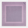 View 4 of product The Lilac Dot Silk Pocket Square by Turnbull & Asser is handmade from silk in a folded design, featuring small black polka dots and a solid border.
