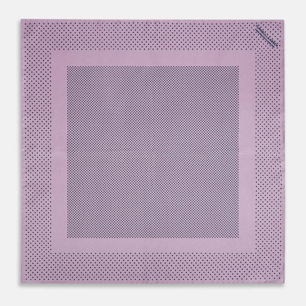 The Lilac Dot Silk Pocket Square by Turnbull & Asser is handmade from silk in a folded design, featuring small black polka dots and a solid border.