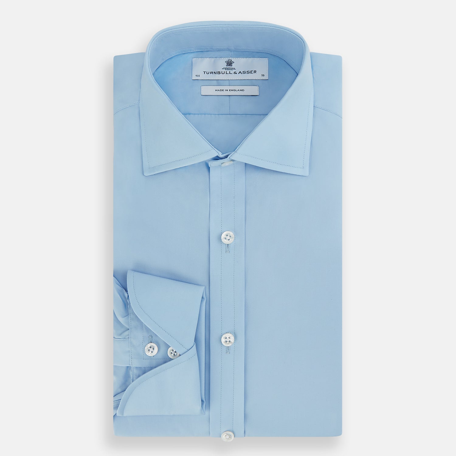 View 5 of product The Turnbull & Asser Dr. No Blue Cotton Shirt with cocktail cuffs, inspired by James Bond, features a classic collar and white buttons, displayed on a plain white background.