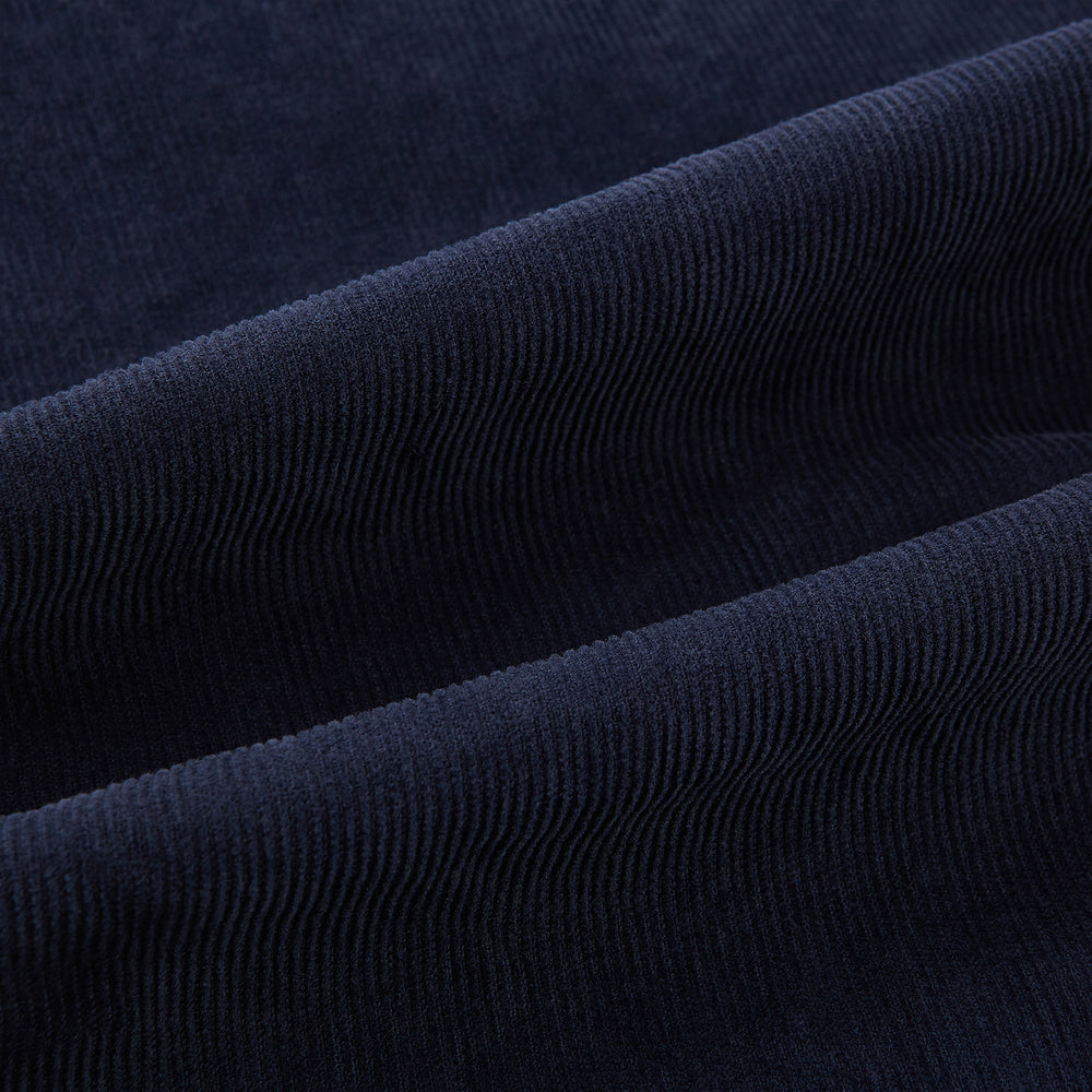The Turnbull & Asser Light Navy Corduroy Charles Trousers feature a straight-leg fit, stretch cotton, belt loops, front pockets, and a button-zip closure—highlighting British tailoring against a white background.