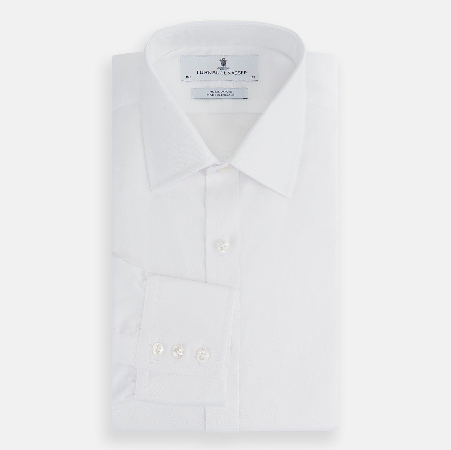 View 4 of product The Turnbull & Asser White Superfine Oxford Cotton Shirt features a T&A collar and 3-button cuffs—ideal for elegant evening attire, shown against a white background.