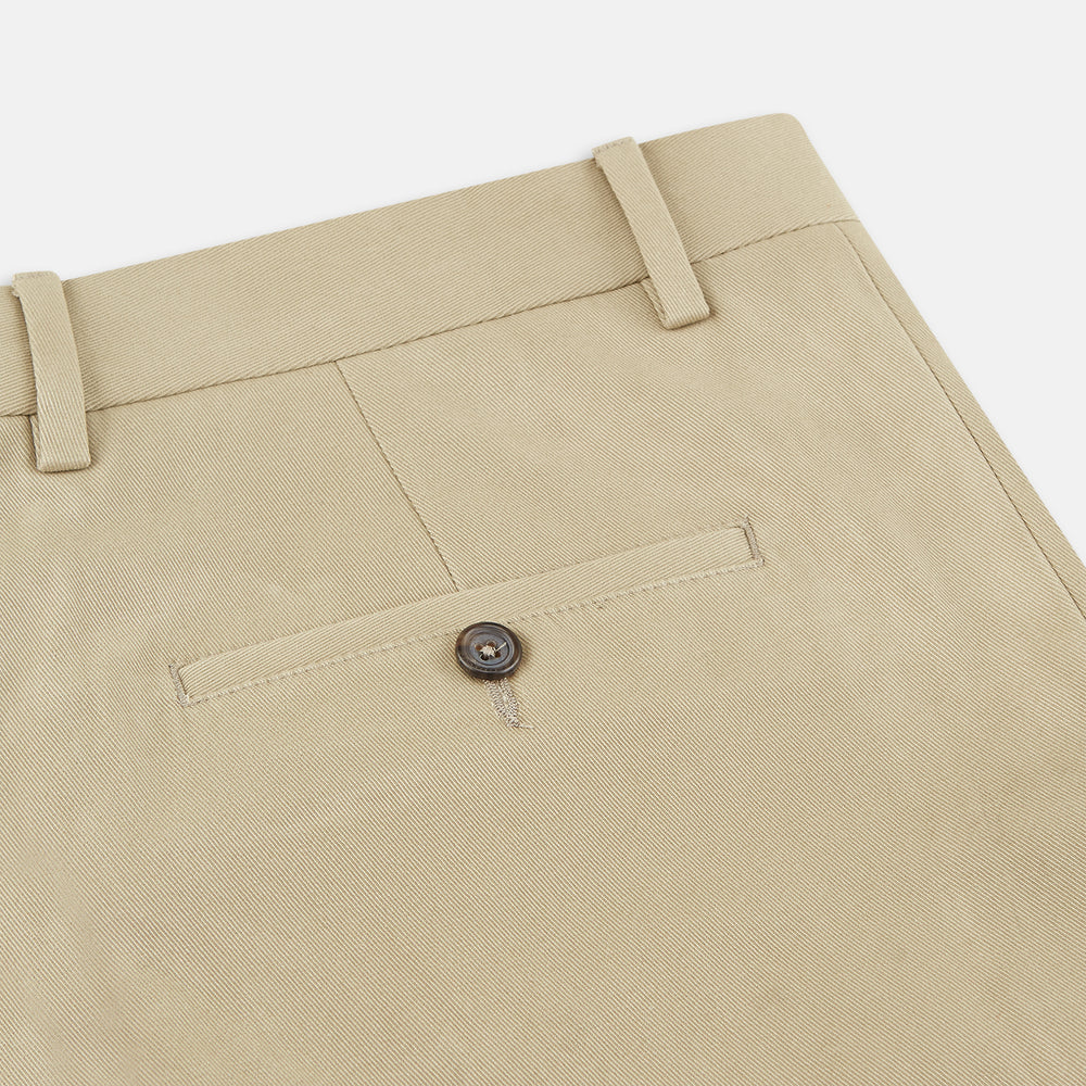 The Turnbull & Asser Beige Cotton Blend Manson Trousers feature a straight-leg cut, belt loops, side pockets, and a button closure, shown on a plain white background.