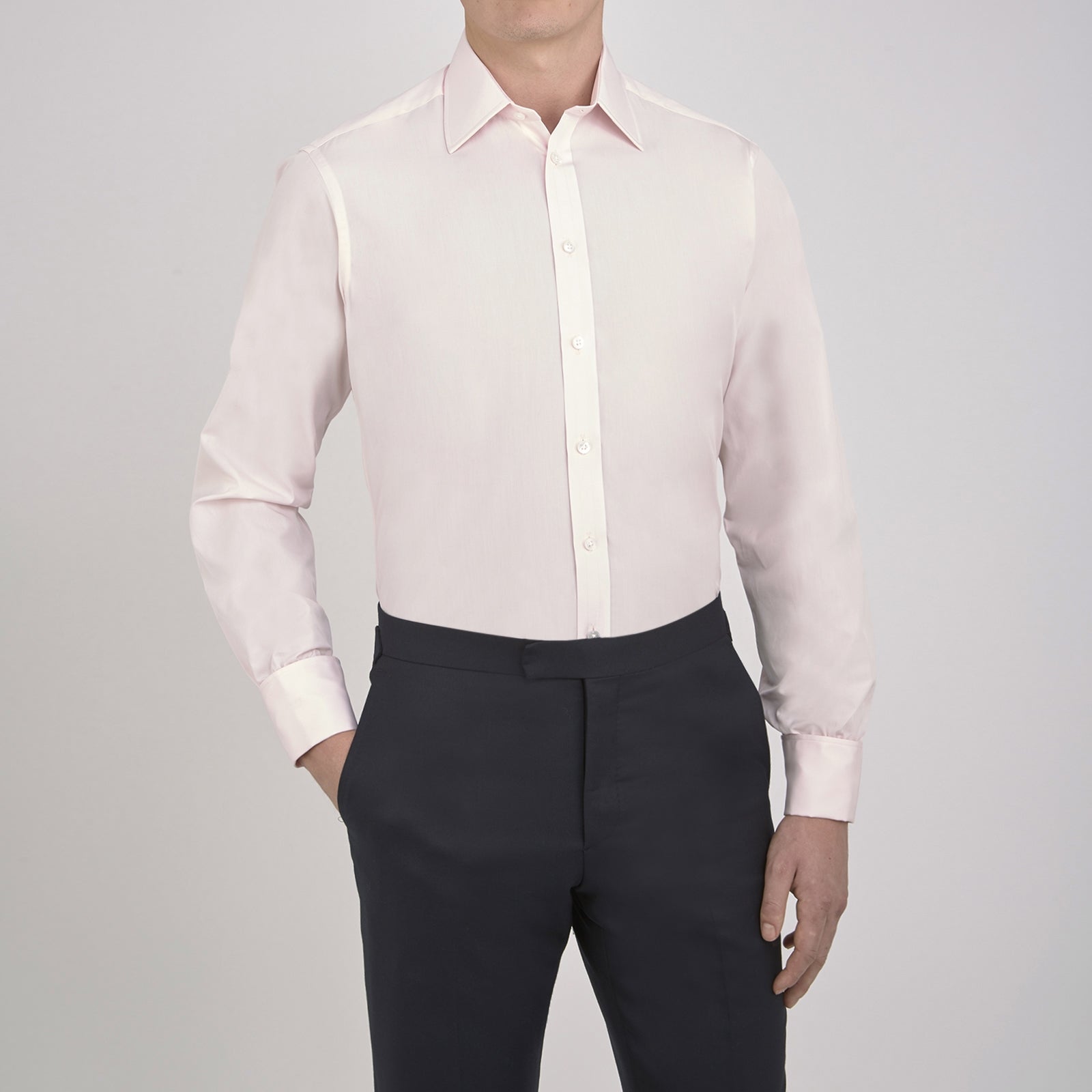 View 5 of product A Turnbull & Asser Pink Cotton Shirt with a T&A collar and double cuffs is displayed against a white background. The men's shirt features long sleeves, white buttons, and the label is visible inside the collar.