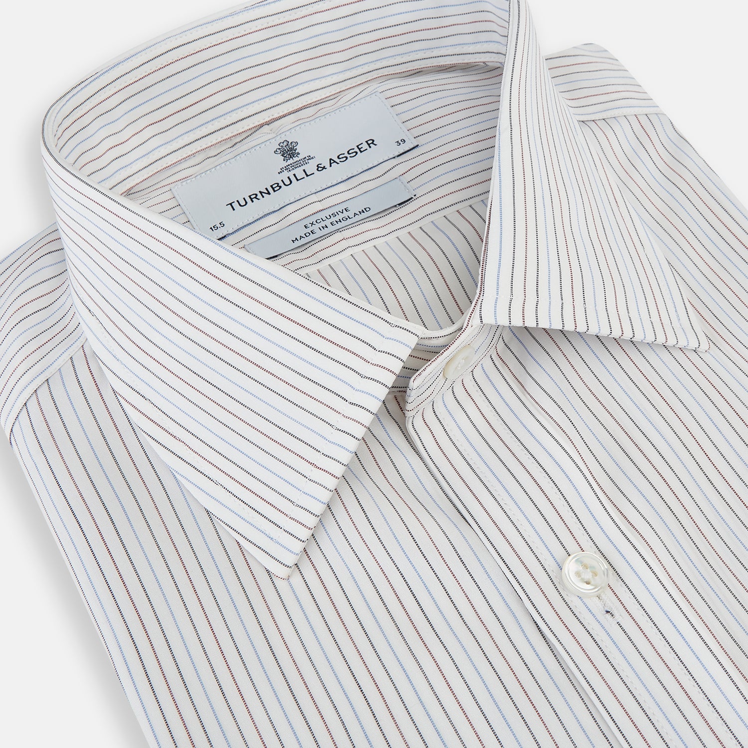 View 2 of product The Turnbull & Asser Red and Blue Double Pinstripe Mayfair Shirt features long sleeves, a collar, and button-up front, crafted from fine Italian cotton, displayed on a plain white background.