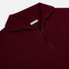 View 2 of product The Turnbull & Asser Ruby Red Half-Zip Cashmere Jumper, with a stand-up collar and elegant design, is displayed against a plain white background.