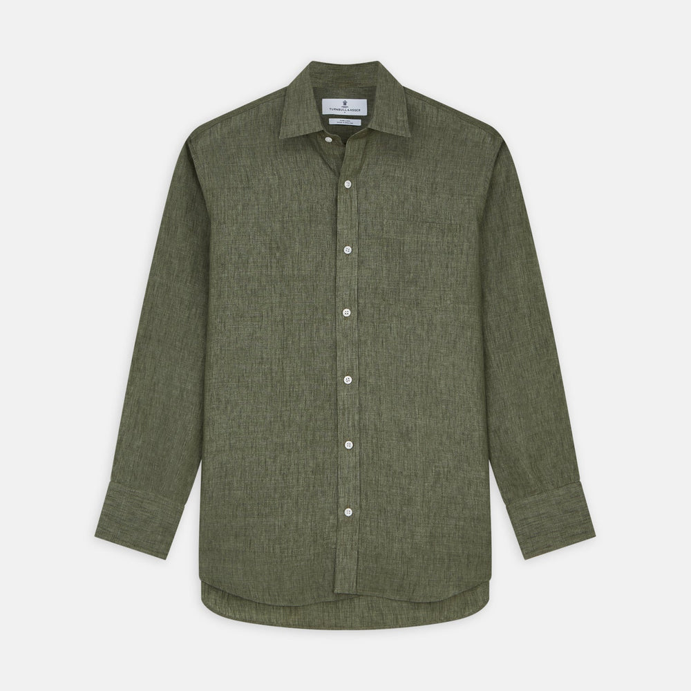 Close-up of Turnbull & Asser’s Sage Green Plain Linen Fabric, highlighting its fine diagonal weave within a circular frame on a white background.