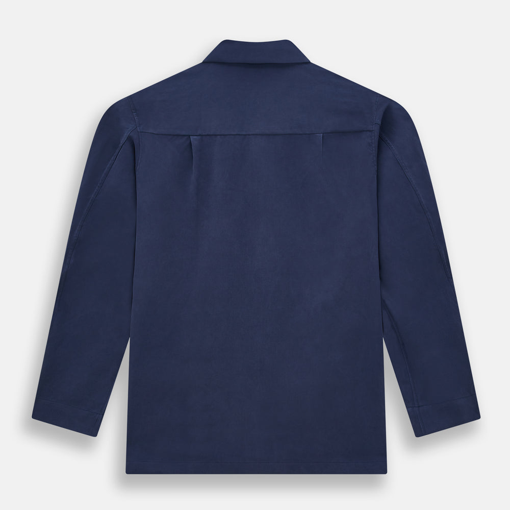 Turnbull & Asser Navy Silk Pyjama Set, laid flat on a white background, includes a long-sleeve button-up shirt with chest pocket and drawstring pants.