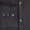 View 4 of product The Ash Linen Windsor Shirt by Turnbull & Asser is a long-sleeve, button-up black shirt with a Windsor collar and cuffs, reflecting British craftsmanship, shown on a plain white background.
