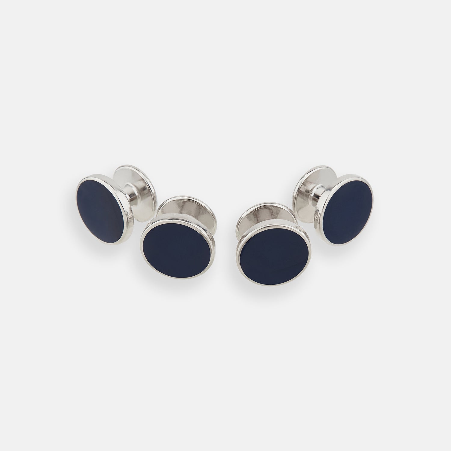 View 1 of product Turnbull & Asser's Navy Circle Dress Studs, a set of four sterling silver cufflinks with dark blue oval faces, are the ideal gentleman's accessory—timelessly sophisticated and perfect for elevating any formal look.