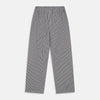 View 3 of product The Turnbull & Asser Black Candy Stripe Cotton Hyde Pyjama Set for men features soft cotton striped pajamas with a long-sleeve, button-up shirt detailed with black piping and three pockets, plus matching pants, both laid flat on a white background.