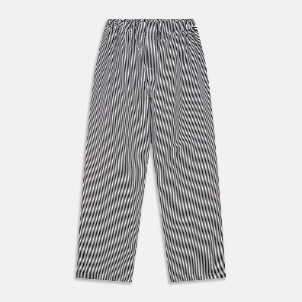The Turnbull & Asser Black Candy Stripe Cotton Hyde Pyjama Set for men features soft cotton striped pajamas with a long-sleeve, button-up shirt detailed with black piping and three pockets, plus matching pants, both laid flat on a white background.