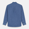 View 3 of product The Blue Weekend Fit Linen Finch Shirt by Turnbull & Asser features a Derby collar, chest pocket, and white buttons. Made from mid-blue linen chambray, it offers effortless casual style when laid flat on a plain white background.