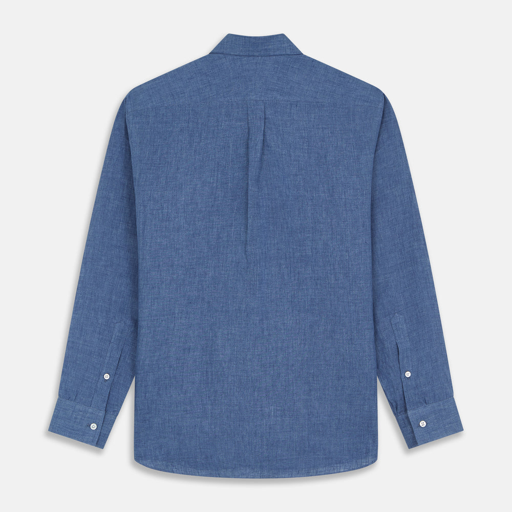 The Blue Weekend Fit Linen Finch Shirt by Turnbull & Asser features a Derby collar, chest pocket, and white buttons. Made from mid-blue linen chambray, it offers effortless casual style when laid flat on a plain white background.