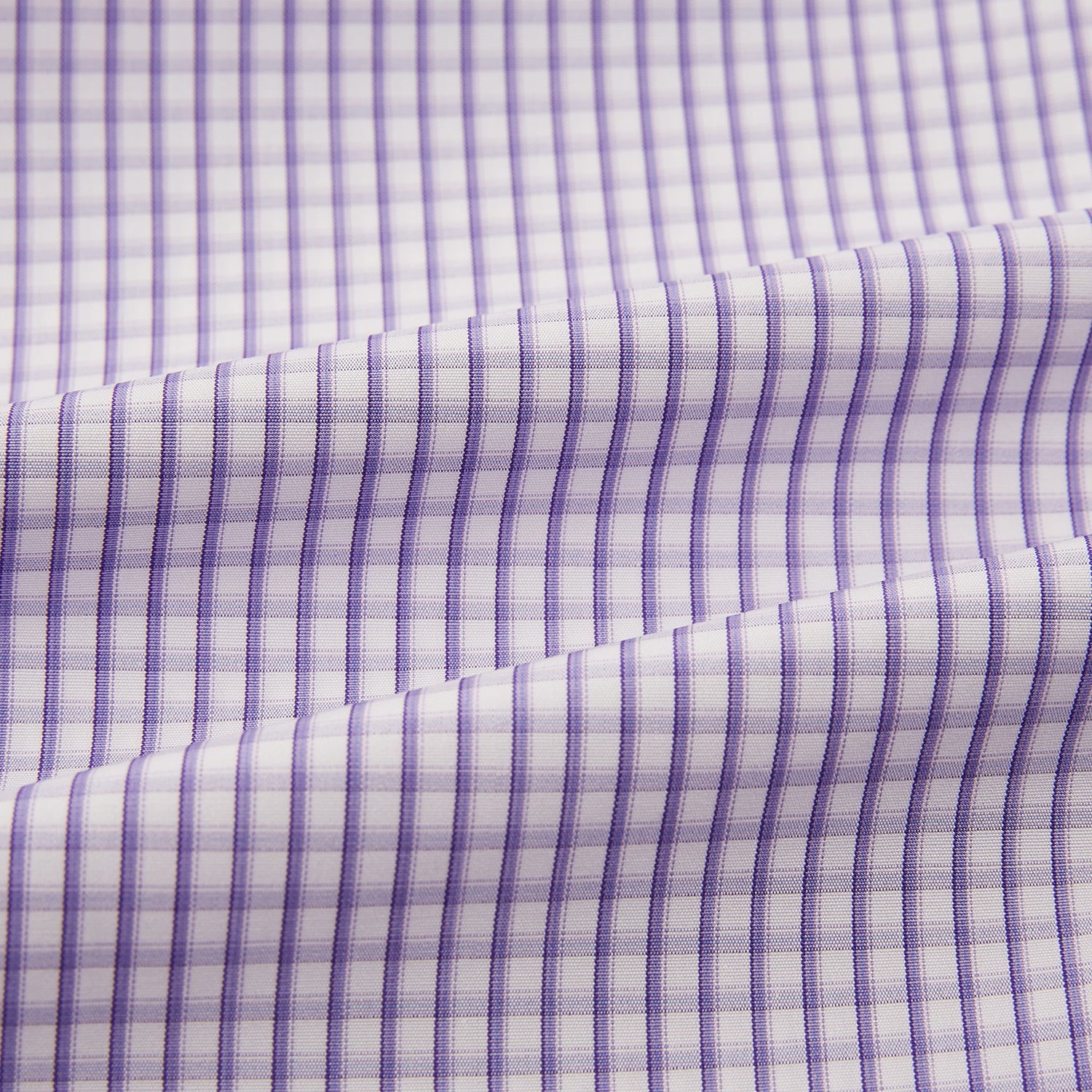 View 6 of product The Turnbull & Asser Purple Micro Shadow Check Mayfair Shirt features long sleeves, a classic collar, white buttons, and a subtle blue and white check pattern—perfect for formal wear and shown on a plain white background.