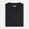 View 4 of product The Turnbull & Asser Charcoal Grey Melange V-Neck Cashmere Jumper is shown on a white background, featuring long sleeves, ribbed cuffs and hem for classic style and comfort.