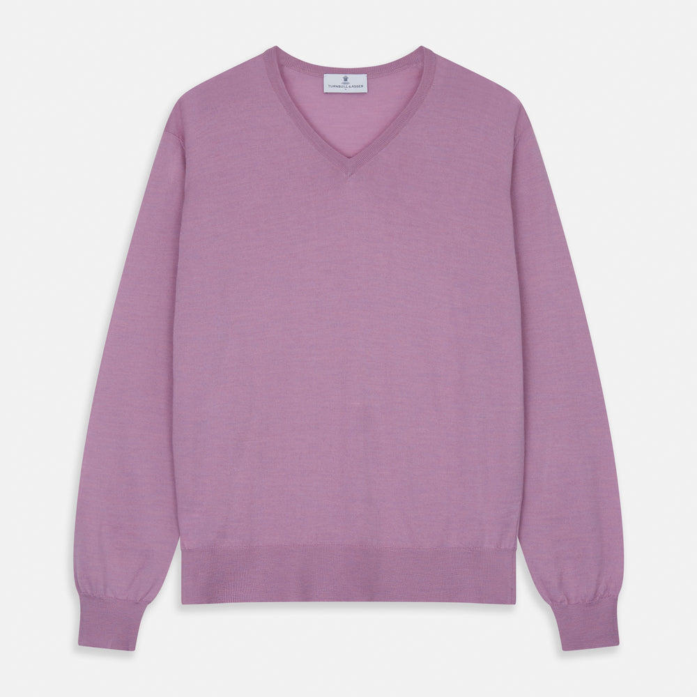 The Pink Merino Kennedy V-Neck Jumper by Turnbull & Asser features long sleeves with ribbed cuffs and waistband, shown on a plain white background—ideal for knitwear lovers.