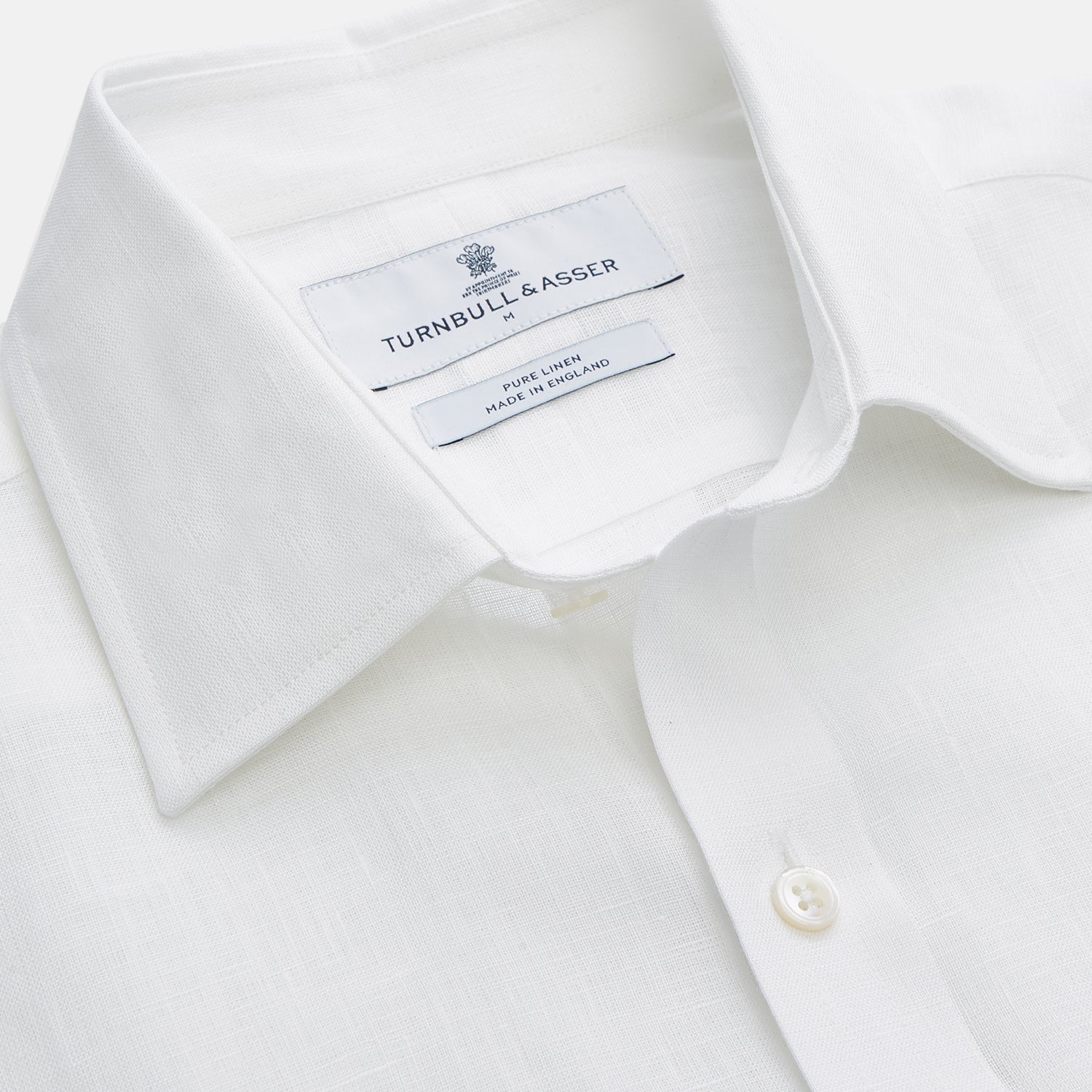 View 2 of product The Turnbull & Asser White Weekend Fit Linen Finch Shirt features a Derby collar and chest pocket, laid flat on a white background—an effortlessly classic choice for casual weekends.