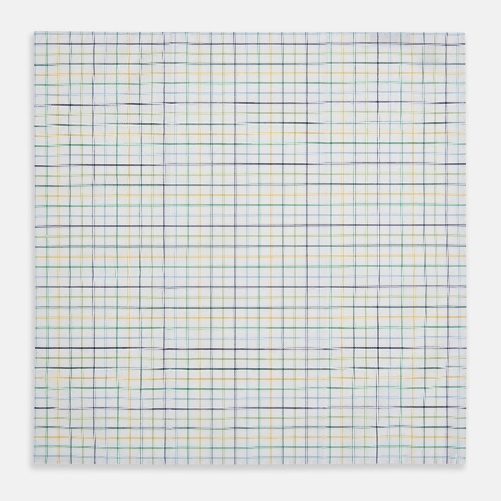 The Yellow Multi Double Grid Check Hand-Rolled Handkerchief by Turnbull & Asser is handcrafted in England, featuring a colorful check pattern with evenly spaced blue, green, yellow, and purple lines.